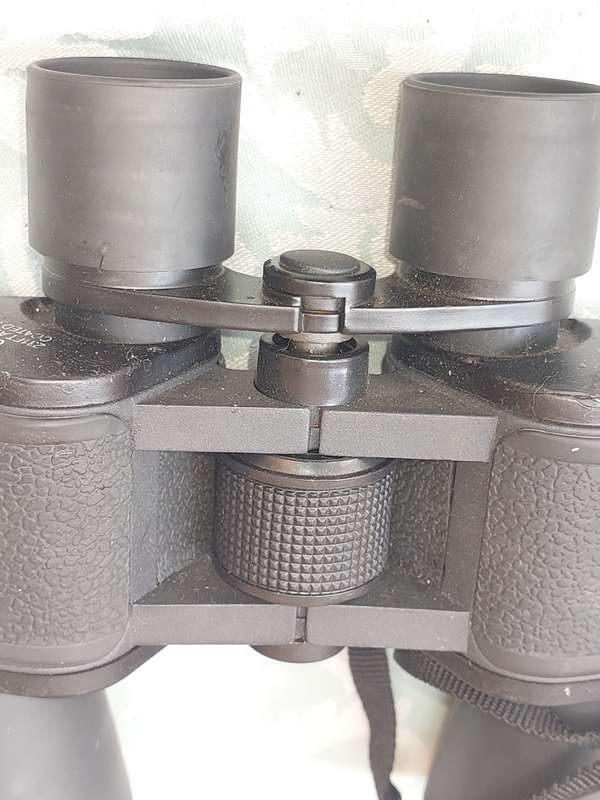 A USED 60X60 BINOCULARS SOLD AS IS