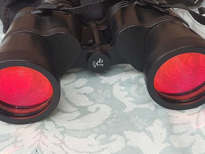 A TASCO 10X50MM BINOCULARS SOLD AS IS