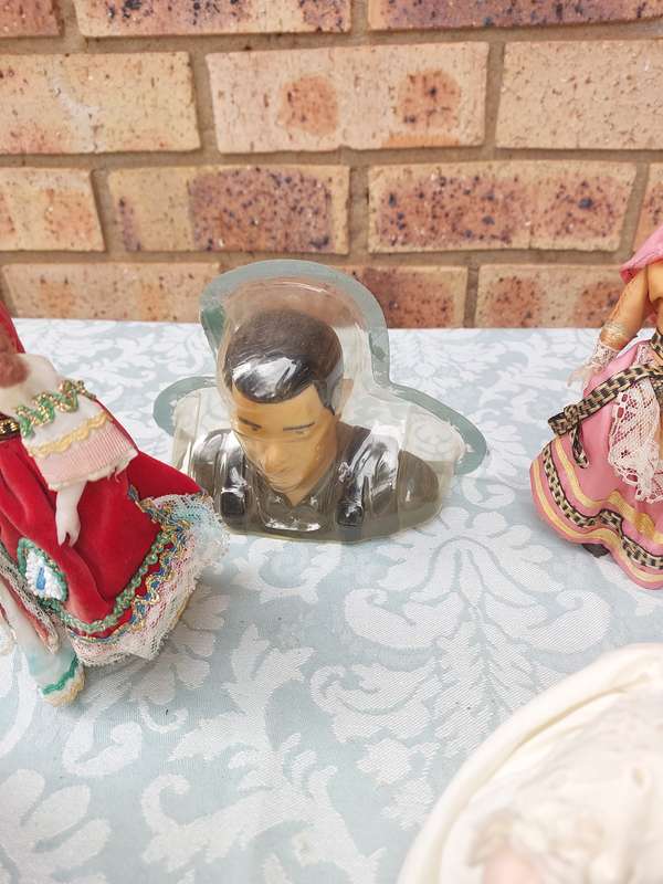 A VINTAGE COLLECTION OF DOLLS AND FIGURINES SOLD AS IS