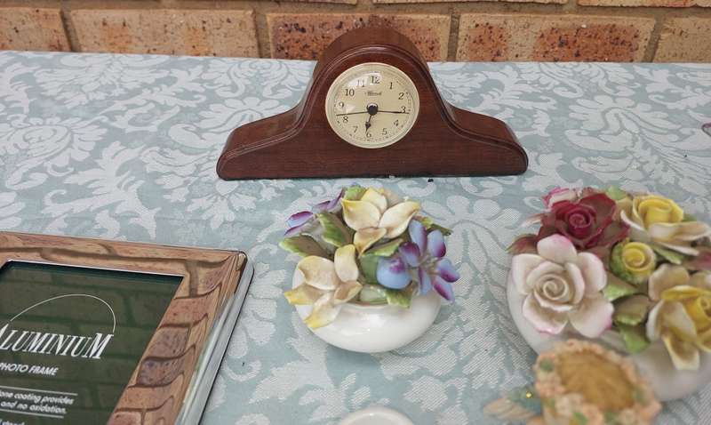 A COLLECTION OF FIGURINES AND A SILVER PLATED PHOTO FRAME SOLD AS IS