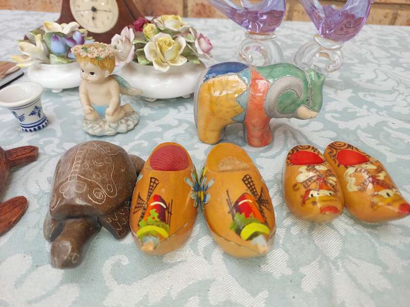 A COLLECTION OF FIGURINES AND A SILVER PLATED PHOTO FRAME SOLD AS IS