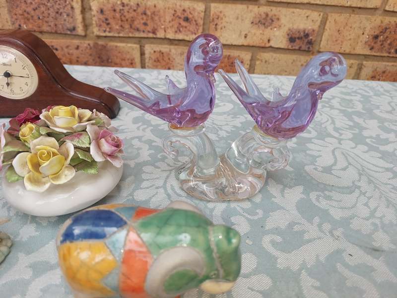 A COLLECTION OF FIGURINES AND A SILVER PLATED PHOTO FRAME SOLD AS IS