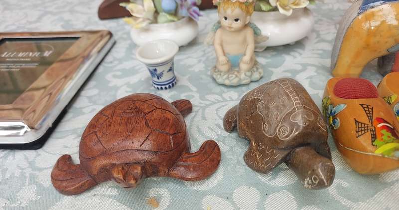 A COLLECTION OF FIGURINES AND A SILVER PLATED PHOTO FRAME SOLD AS IS