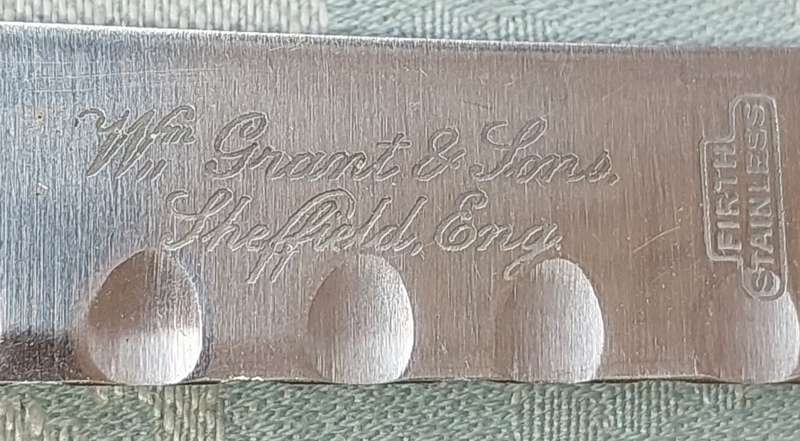 A SET OF FIVE VINTAGE BONE HANDLED STEAK KNIVES