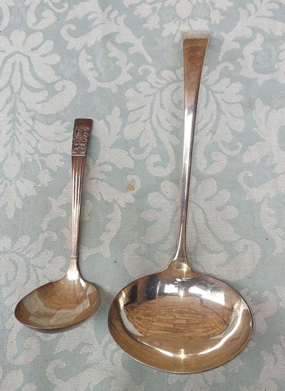 TWO SOUP LADELS SOLD AS IS