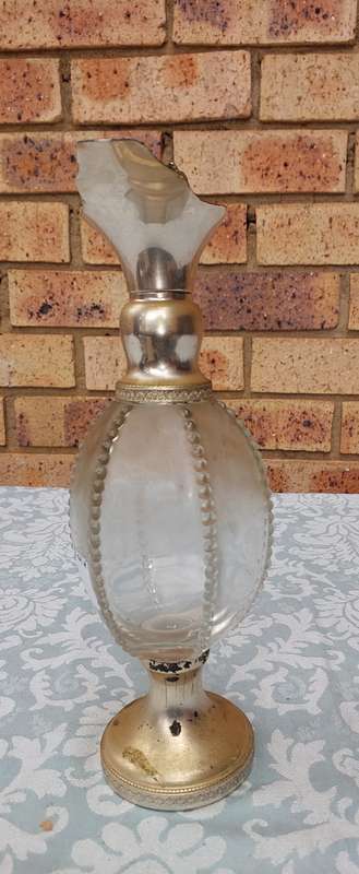 AN ORNATE ART DECOR OIL JUG SOLD AS IS