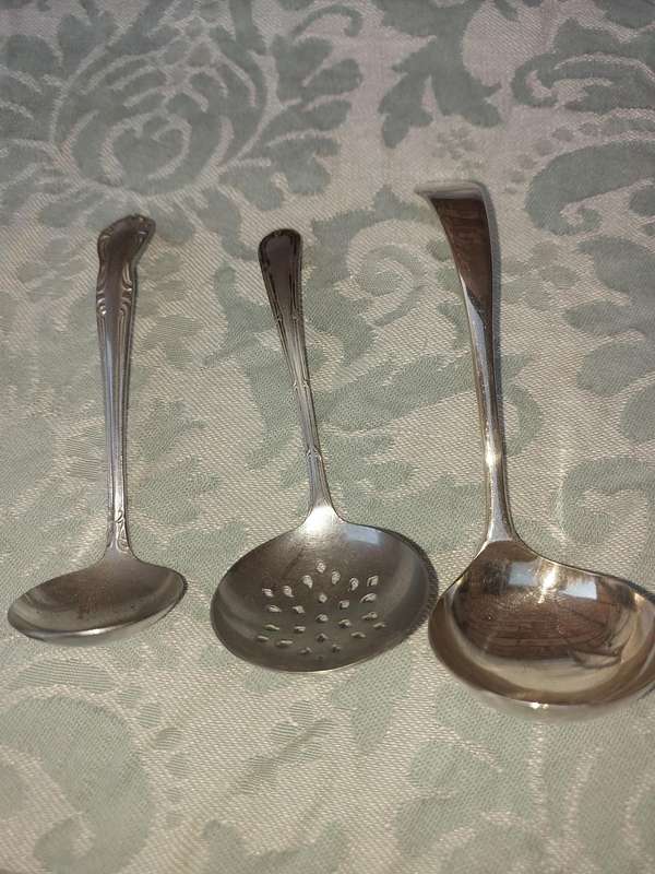 A COLLECTION OF 3 SUGAR OR SAUCE LADLES SOLD AS IS