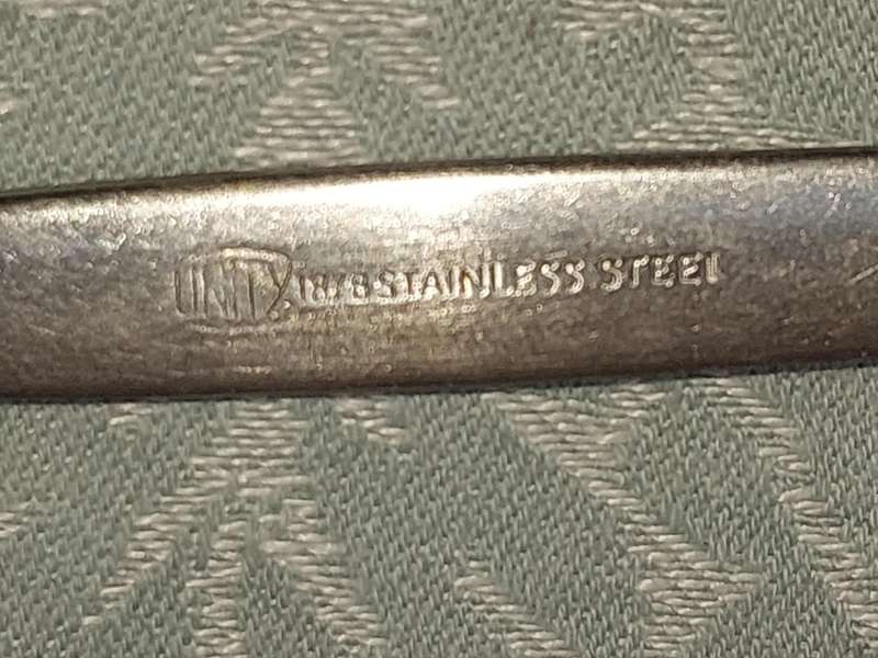 A VINTAGE SET OF 7 UNITY 18/ 8 STAINLESS STEEL FISH KNIVES SOLD AS IS