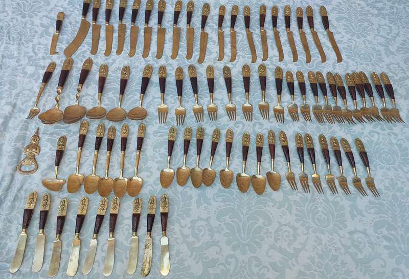 A 72 PIECE SIAM BUDDHA  NICKEL BRONZE CUTLERY SET MADE IN THAILAND SOLD AS IS