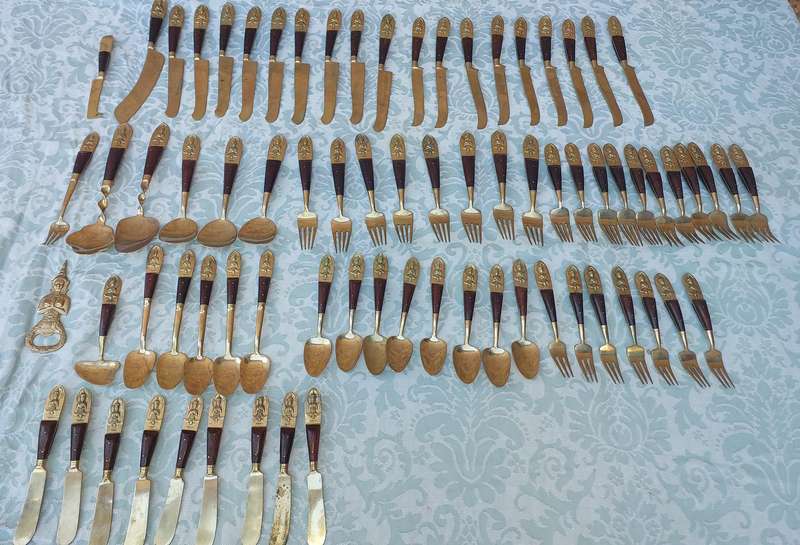 A 72 PIECE SIAM BUDDHA  NICKEL BRONZE CUTLERY SET MADE IN THAILAND SOLD AS IS