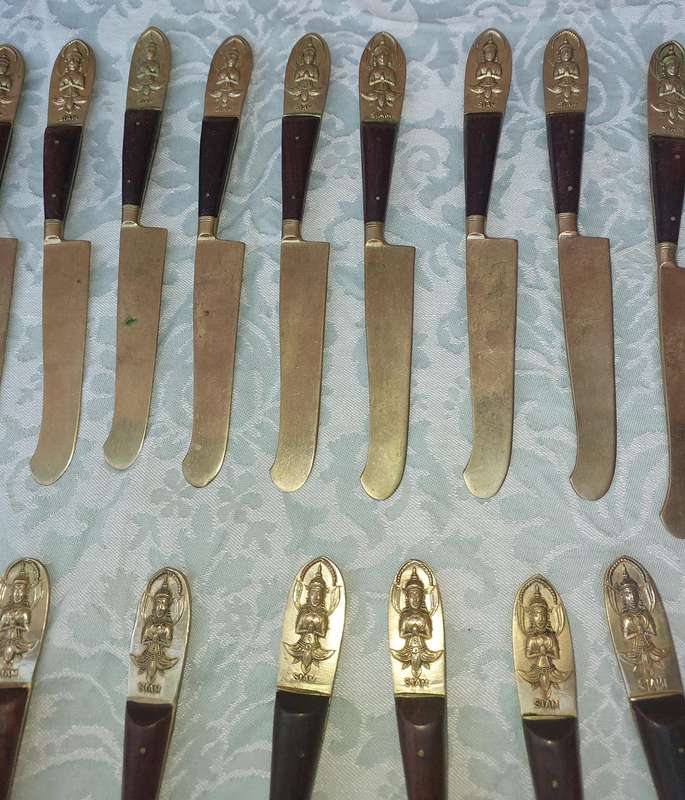 A 72 PIECE SIAM BUDDHA  NICKEL BRONZE CUTLERY SET MADE IN THAILAND SOLD AS IS