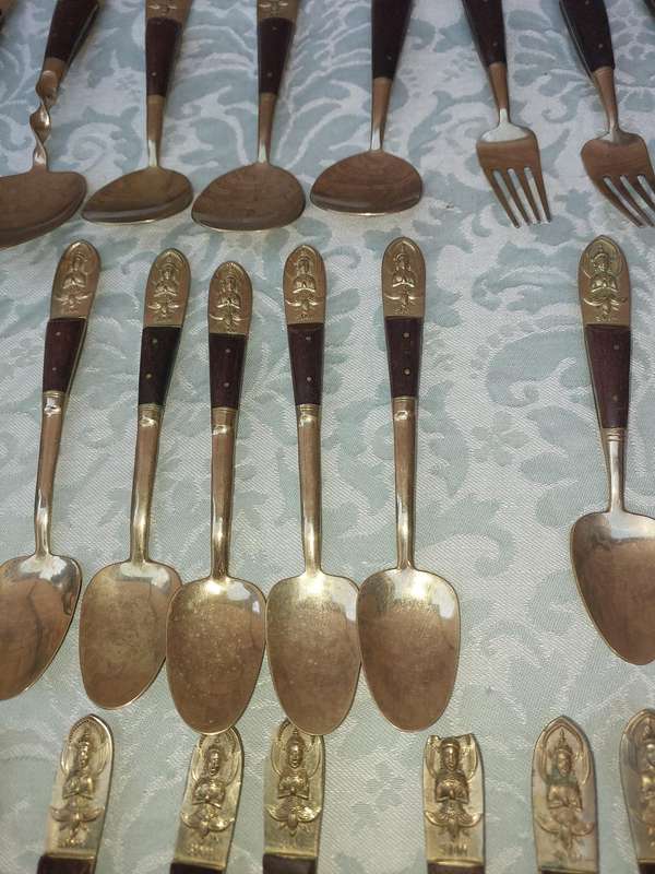 A 72 PIECE SIAM BUDDHA  NICKEL BRONZE CUTLERY SET MADE IN THAILAND SOLD AS IS