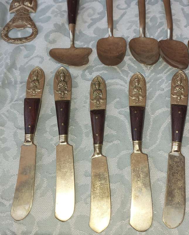 A 72 PIECE SIAM BUDDHA  NICKEL BRONZE CUTLERY SET MADE IN THAILAND SOLD AS IS