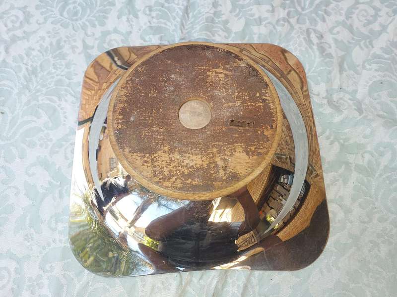 A VINTAGE ART DECOR SERVING PLATTER STAINLESS STEEL WITH A WOODEN FOOT SOLD AS IS