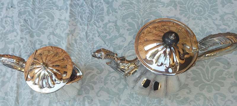 TWO VINTAGE SILVER PLATED TEA JUGS VICTORIAN SOLD AS IS