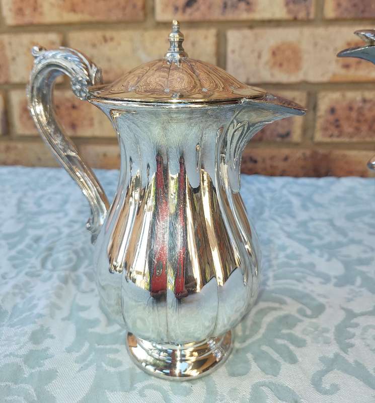 TWO VINTAGE SILVER PLATED TEA JUGS VICTORIAN SOLD AS IS
