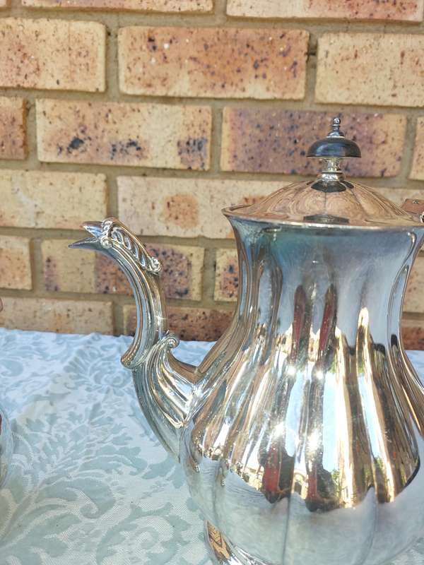 TWO VINTAGE SILVER PLATED TEA JUGS VICTORIAN SOLD AS IS