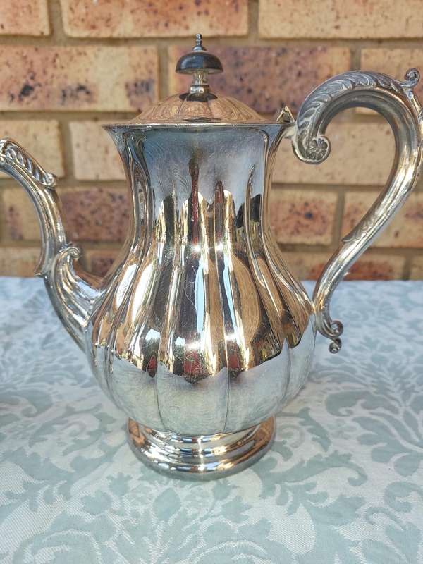 TWO VINTAGE SILVER PLATED TEA JUGS VICTORIAN SOLD AS IS