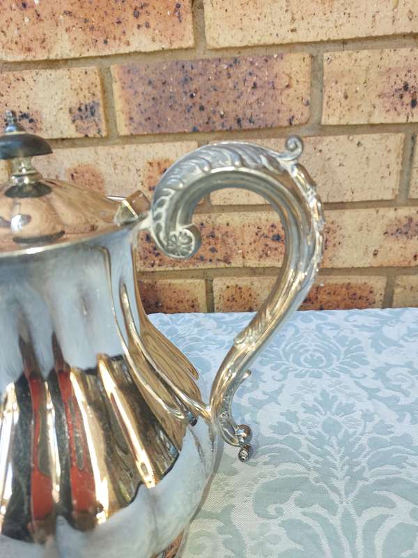 TWO VINTAGE SILVER PLATED TEA JUGS VICTORIAN SOLD AS IS