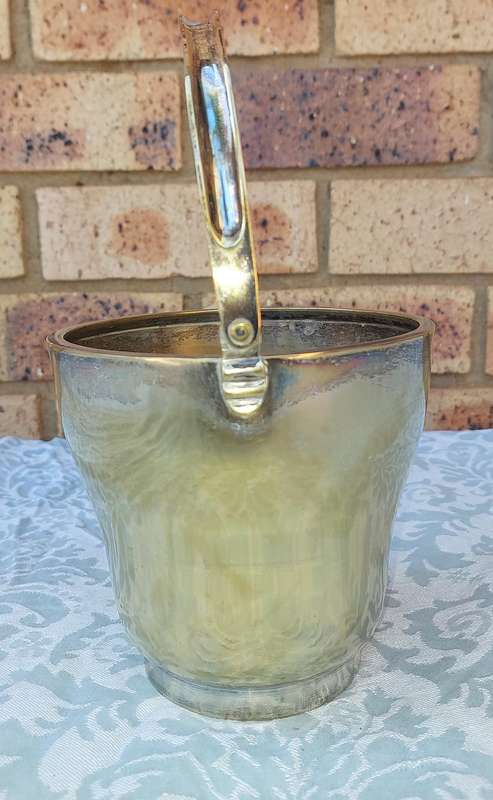 A VINTAGE SILVER PLATED ICE BUCKET SOLD AS IS