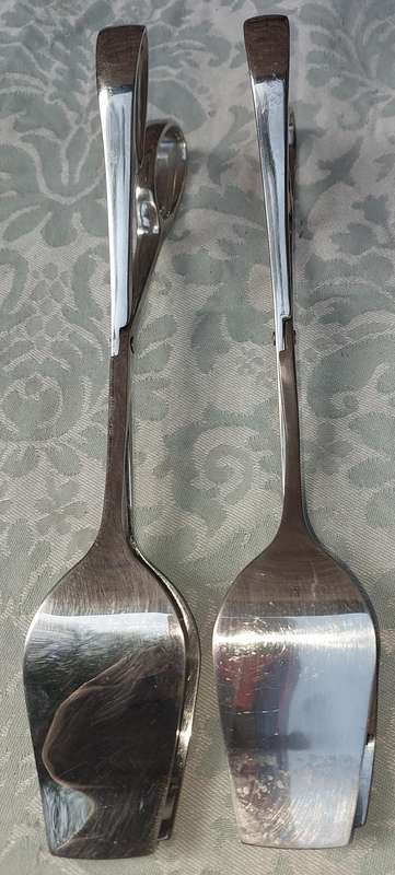 A VINTAGE PAIRS OF SALAD TONGS SOLD AS IS