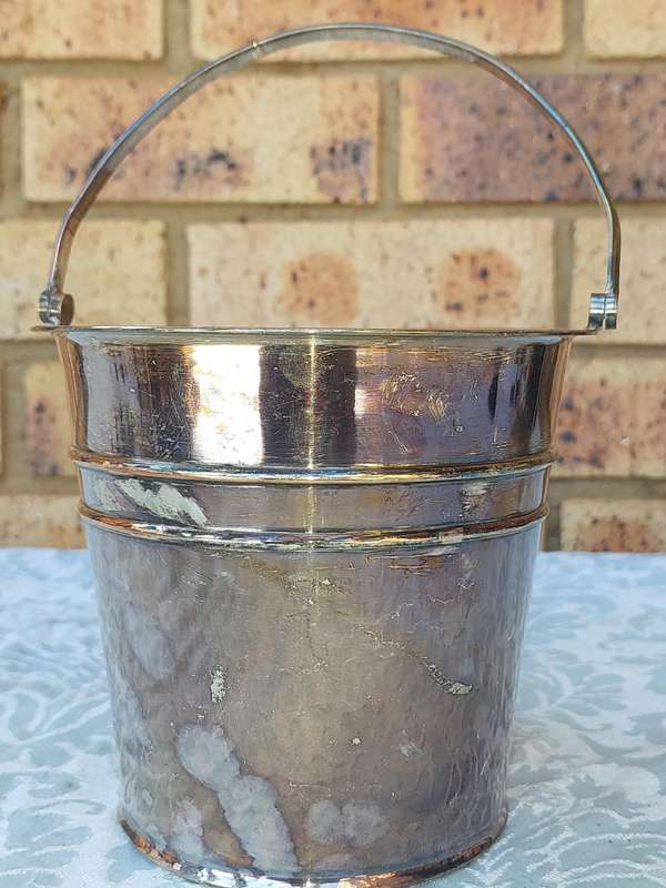 A VINTAGE EM.ESS SP ON COPPER ICE BUCKET SOLD AS IS