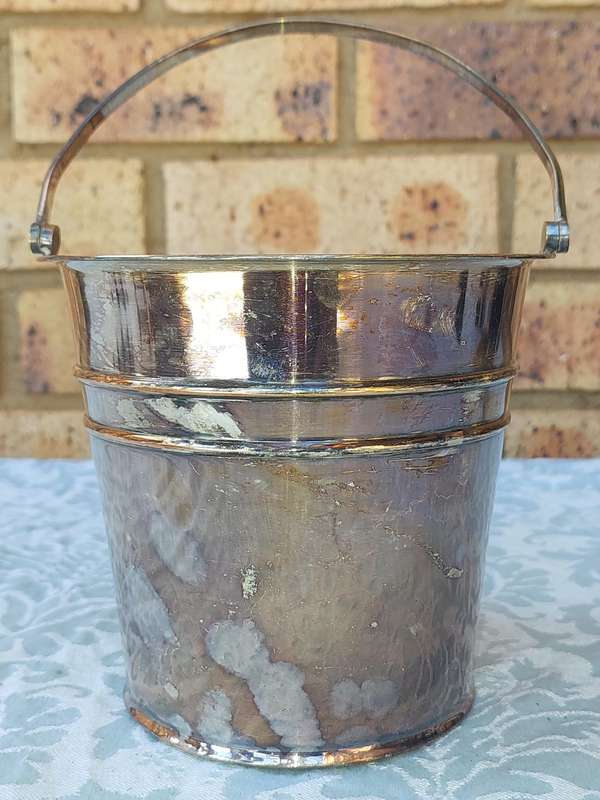 A VINTAGE EM.ESS SP ON COPPER ICE BUCKET SOLD AS IS