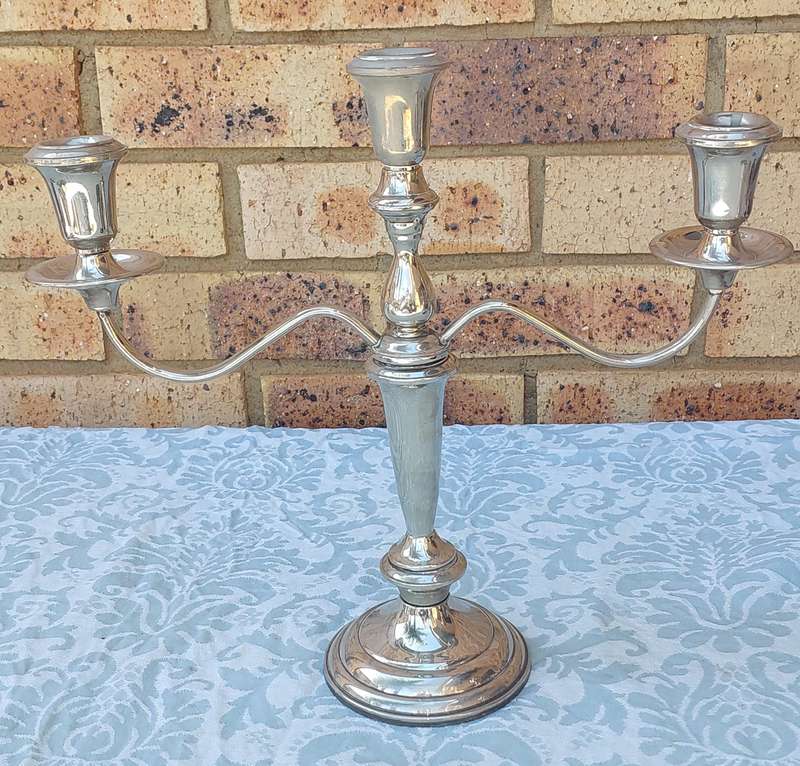 A SILVER PLATED CANDLEBRA NEEDS SOME TLC SOLD AS IS