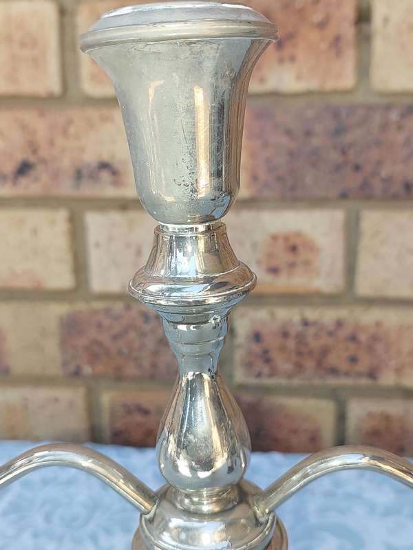 A SILVER PLATED CANDLEBRA NEEDS SOME TLC SOLD AS IS
