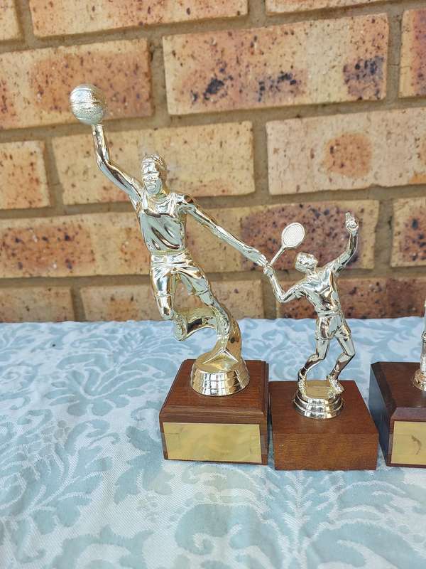 A JOBLOT SPORTS TROPHIES SOLD AS IS