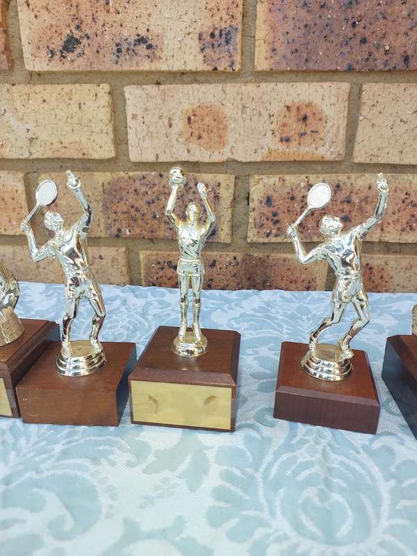 A JOBLOT SPORTS TROPHIES SOLD AS IS