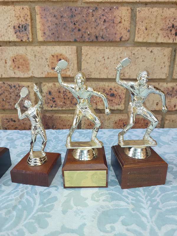A JOBLOT SPORTS TROPHIES SOLD AS IS