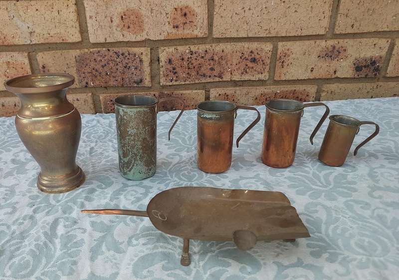A COLLECTION OF ART DECOR BRASS AND COPPER UTENSILS SOLD AS IS