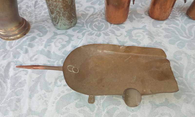 A COLLECTION OF ART DECOR BRASS AND COPPER UTENSILS SOLD AS IS