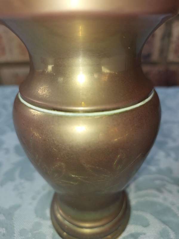 A COLLECTION OF ART DECOR BRASS AND COPPER UTENSILS SOLD AS IS