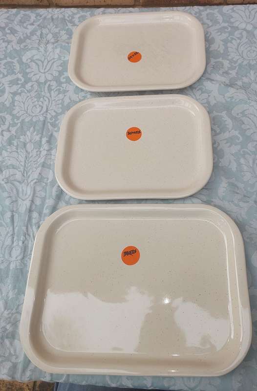 A COLLECTION OF THREE STONEWARE SERVING PLATTERS SOLD AS IS