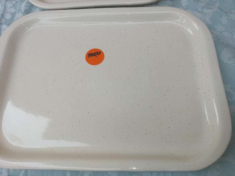 A COLLECTION OF THREE STONEWARE SERVING PLATTERS SOLD AS IS