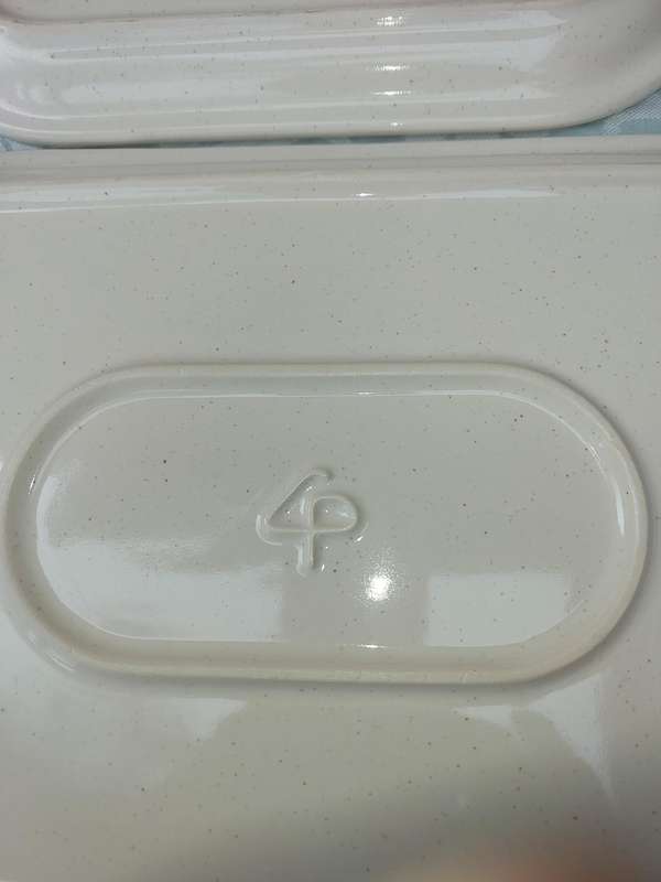 A COLLECTION OF THREE STONEWARE SERVING PLATTERS SOLD AS IS