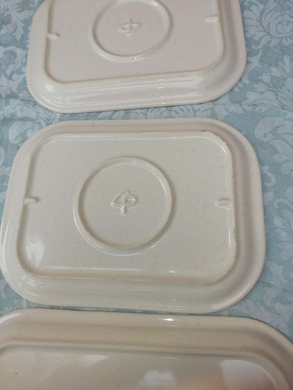 A COLLECTION OF THREE STONEWARE SERVING PLATTERS SOLD AS IS