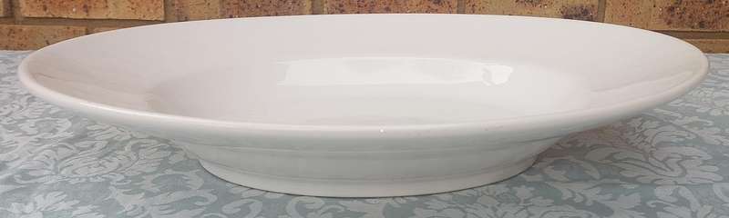 AN OVAL PORCELAIN PLATTER SOLD AS IS