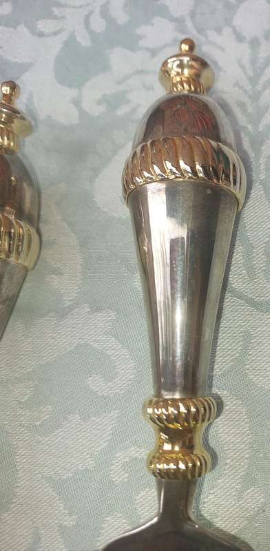 A SET OF ART DECOR STAINLESS STEEL AND BRASS SERVING CUTLERY