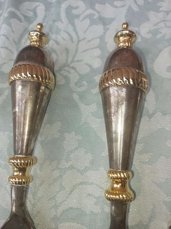 A SET OF ART DECOR STAINLESS STEEL AND BRASS SERVING CUTLERY