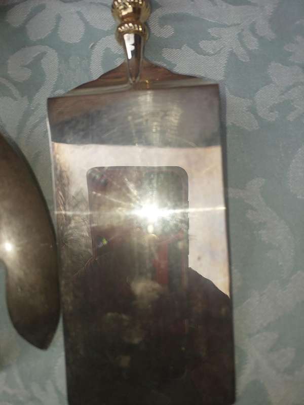 A SET OF ART DECOR STAINLESS STEEL AND BRASS SERVING CUTLERY