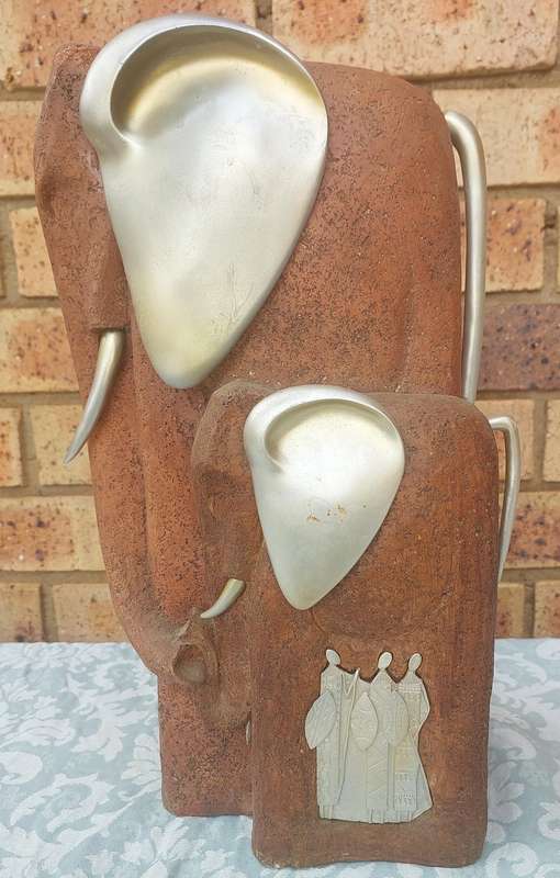 AN ART DECOR WOOD AND ALLOY AFRICAN ELEPHANT COW AND CALF SCULPTURE WITH TRIBAL WARRIERS INLAY