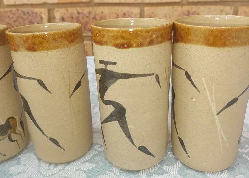 A VINTAGE SET WATER JUG AND FIVE TUMBLERS CERAMICA BY TI POTTERIES WITH AFRICAN DRAWINGS SOLD AS IS