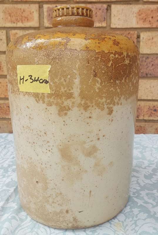 AN ANTIQUE MACDONALD ADAMS & CO LTD GIN CERAMIC JAR WITH A SCREW ON LID NO11  SOLD AS IS