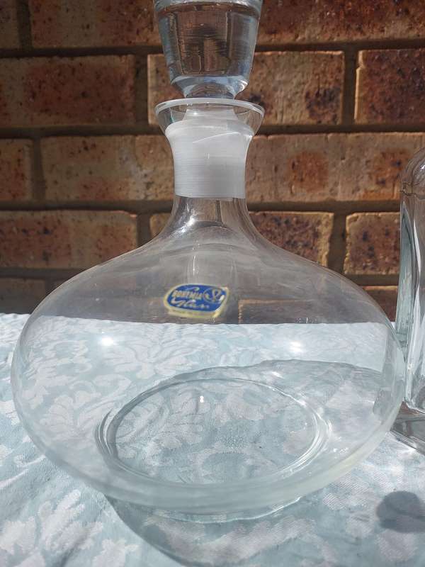 A VINTAGE COLLECTION GLASS DECANTERS FOR THE GENTLEMENS BAR SOLD AS IS
