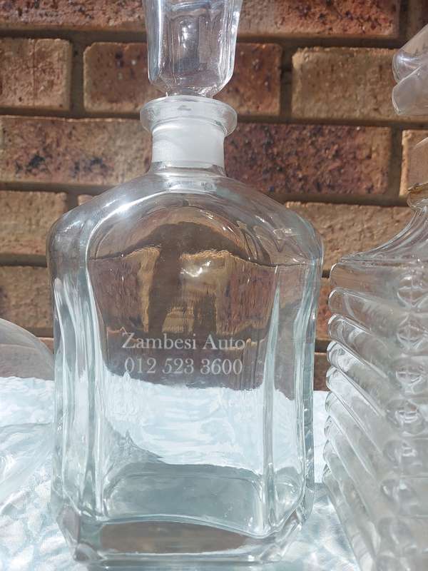 A VINTAGE COLLECTION GLASS DECANTERS FOR THE GENTLEMENS BAR SOLD AS IS