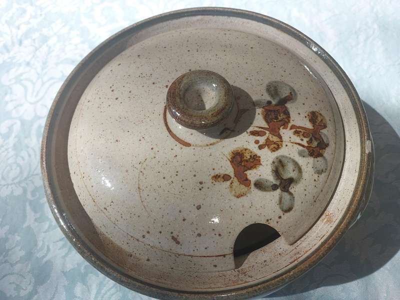 A VINTAGE BAKED CERAMIC SOUP TUREEN SOLD AS IS