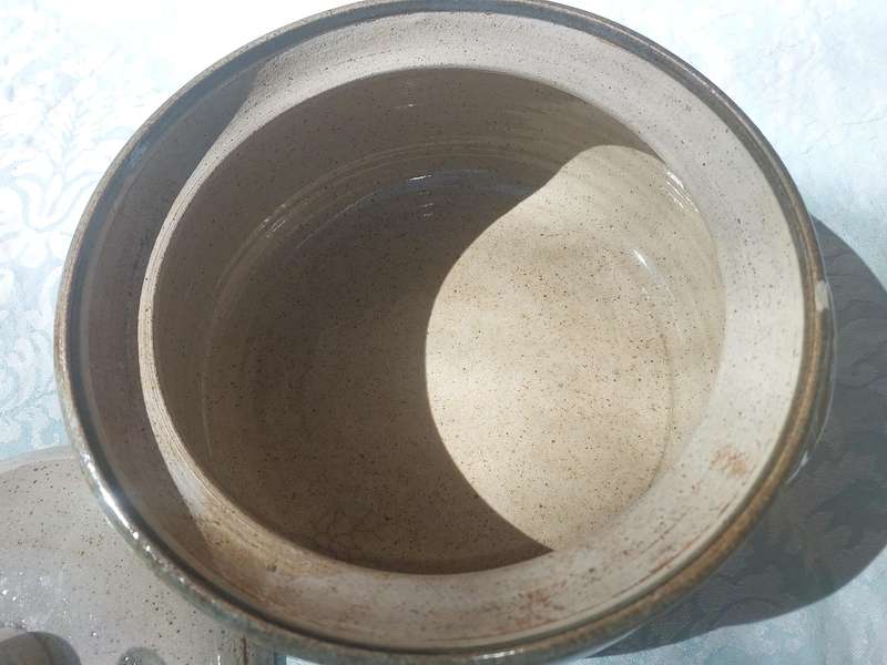 A VINTAGE BAKED CERAMIC SOUP TUREEN SOLD AS IS